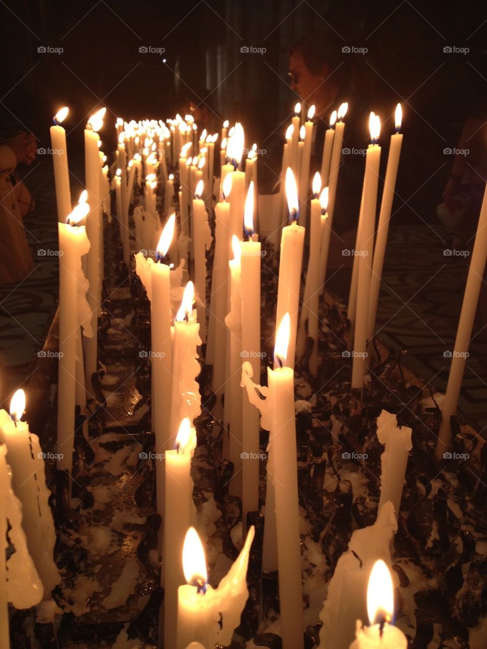 Many taper candles in this church in Italy