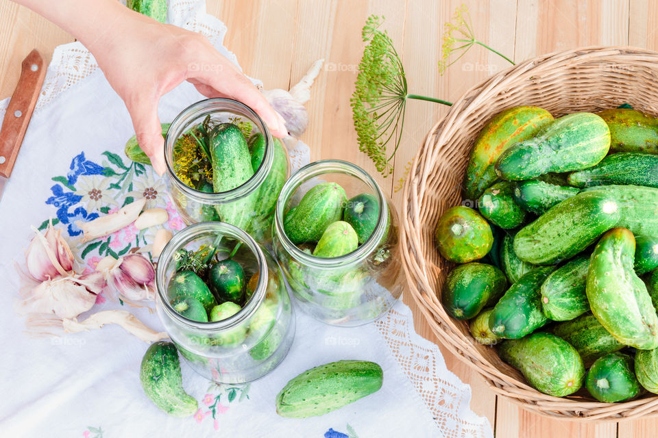 Pickling cucumbers. Pickling cucumbers with home garden vegetables and herbs