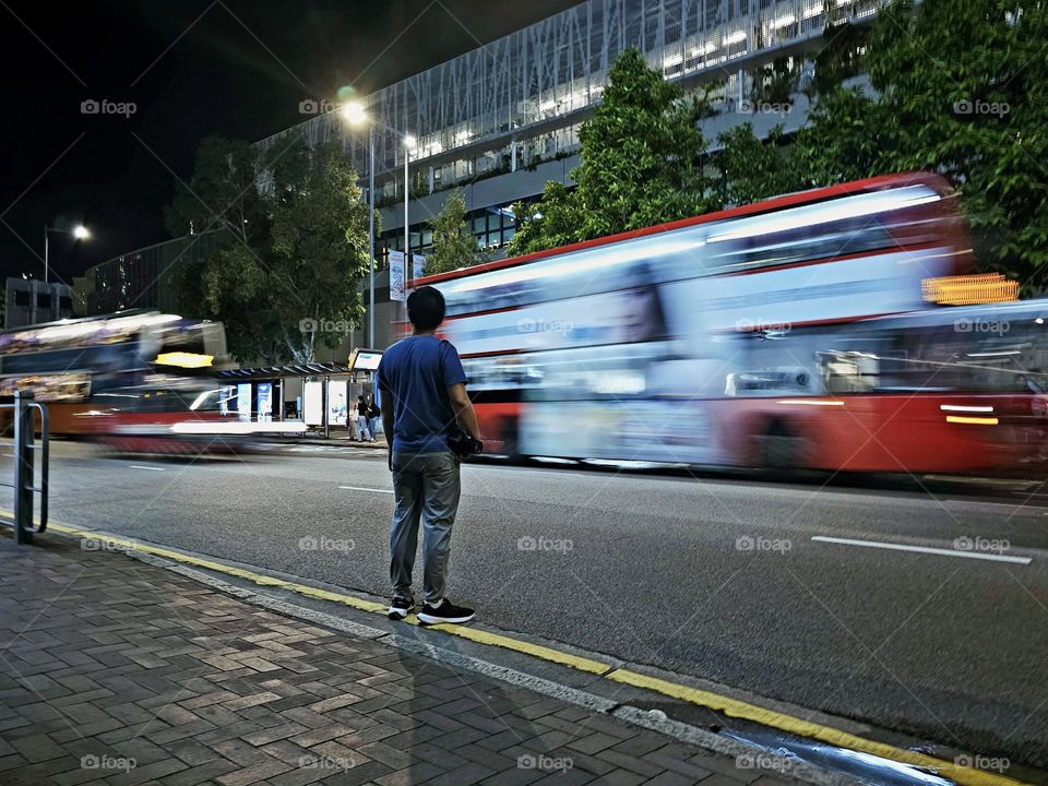 Man waiting to cross the street