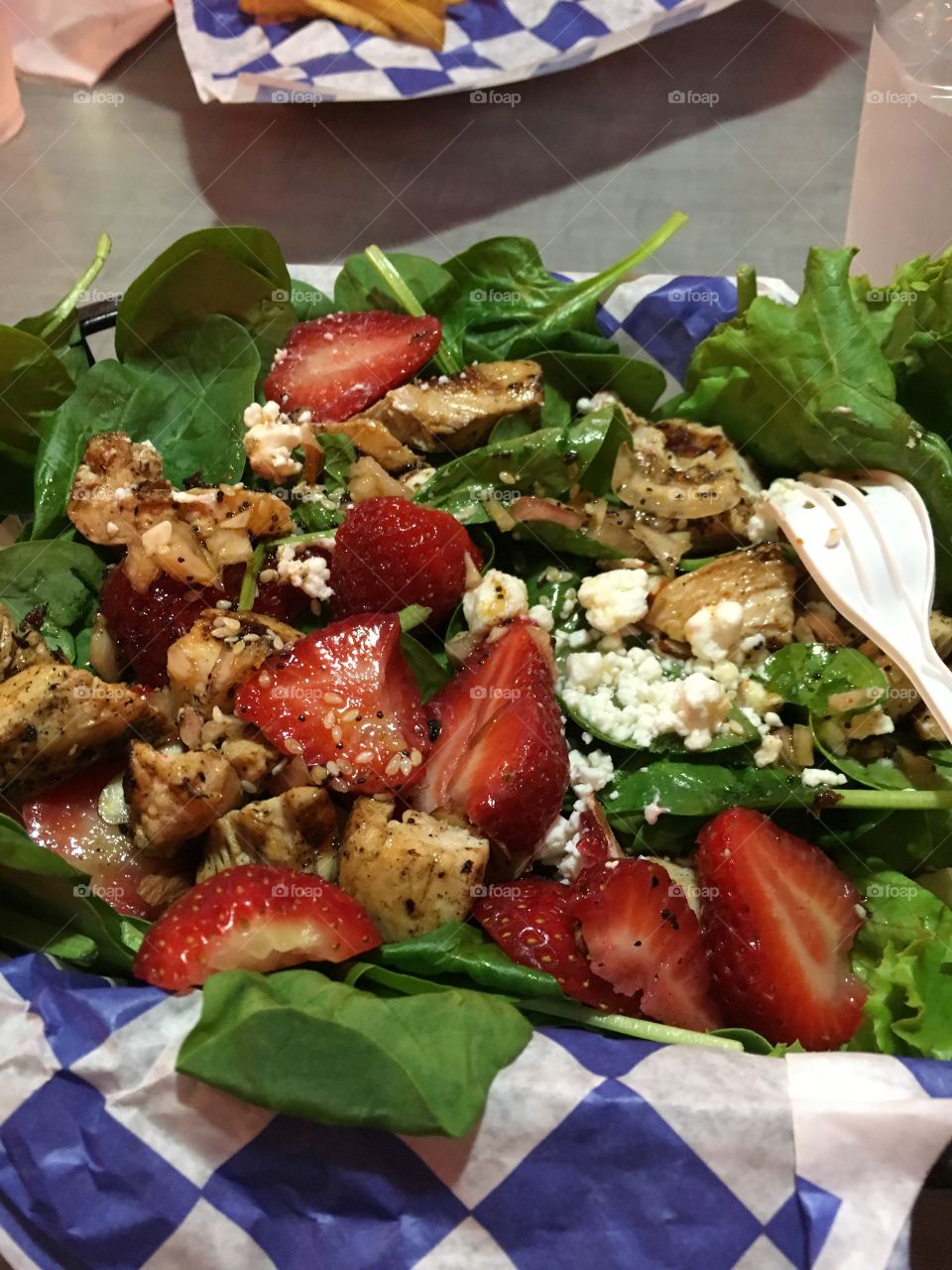Spinach salad with chicken and strawberries