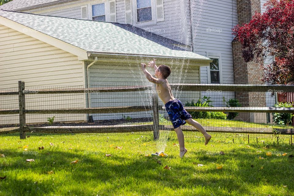 Jumping through the sprinkler