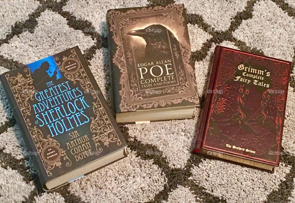 The Greatest Adventures of Sherlock Holmes,
Edgar Allan Poe Complete Tales and Poems, and
Grimm's Complete Fairy Tales.
Three books that I got all at the same time but which book should I read first?