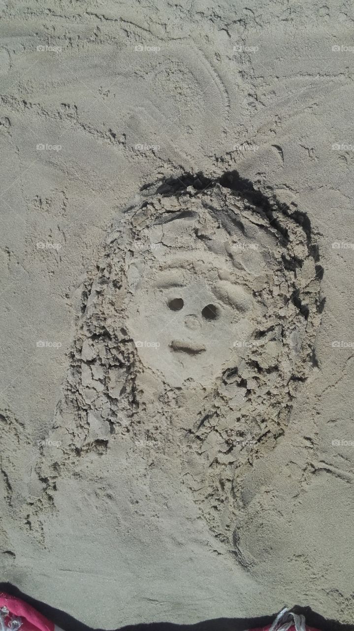 escultura na areia de uma crian
