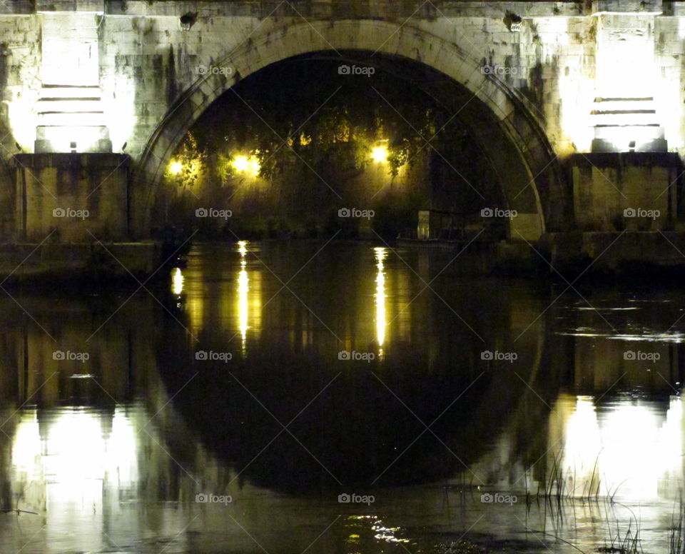 bridge over the river at night with reflection