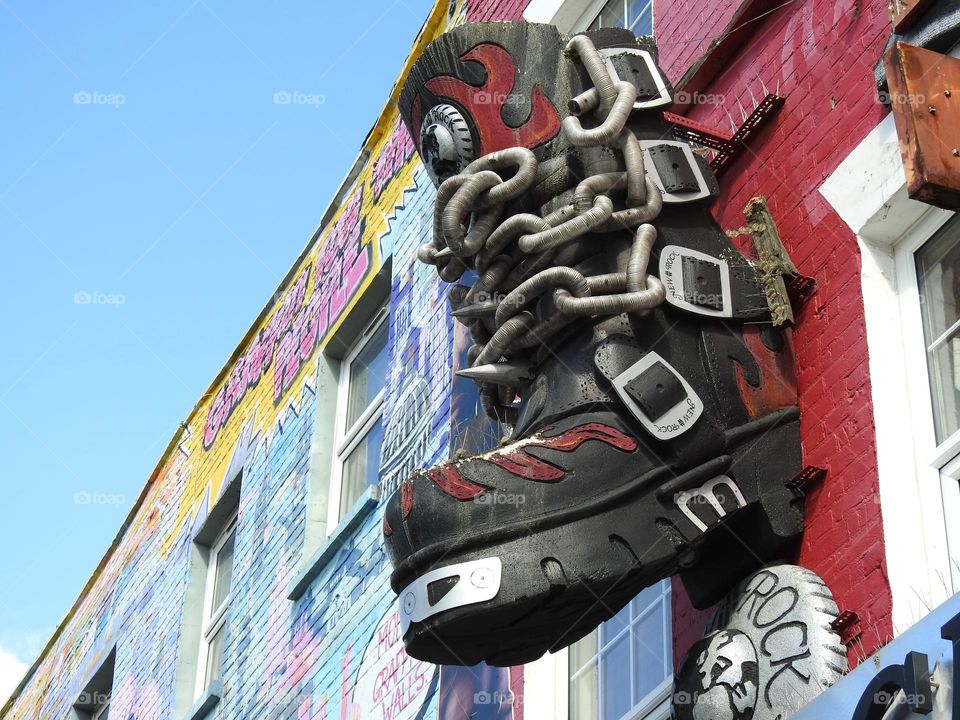 Big boot on the Camden Town building wall, London, UK