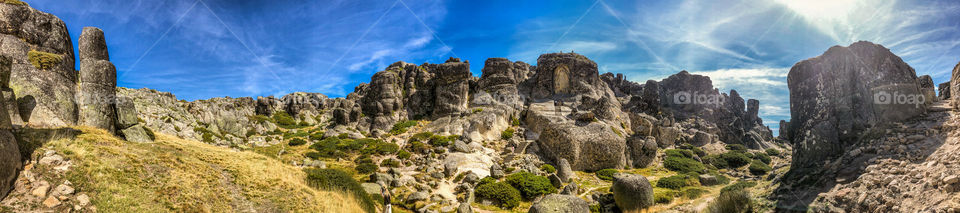 Panorama view of the rock formations, which includes Nossa Senhora da Boa Estrela sculpture carved in relief from the rock 