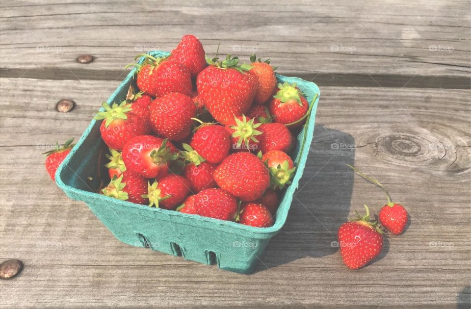 Fresh-Picked Strawberries on Picnic Table