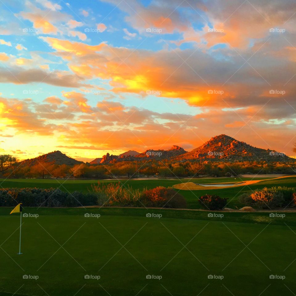 Golf course field during sunset