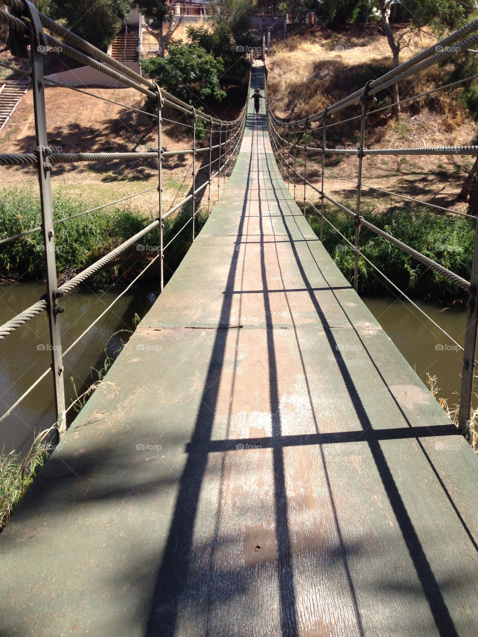 View of wood bridge over river