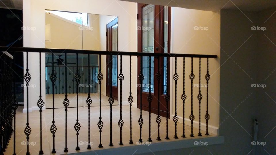 inside upscale wrought iron Bannister entryway