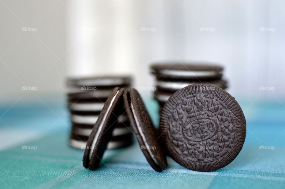 Oreo cookie thins on a white and light blue background 