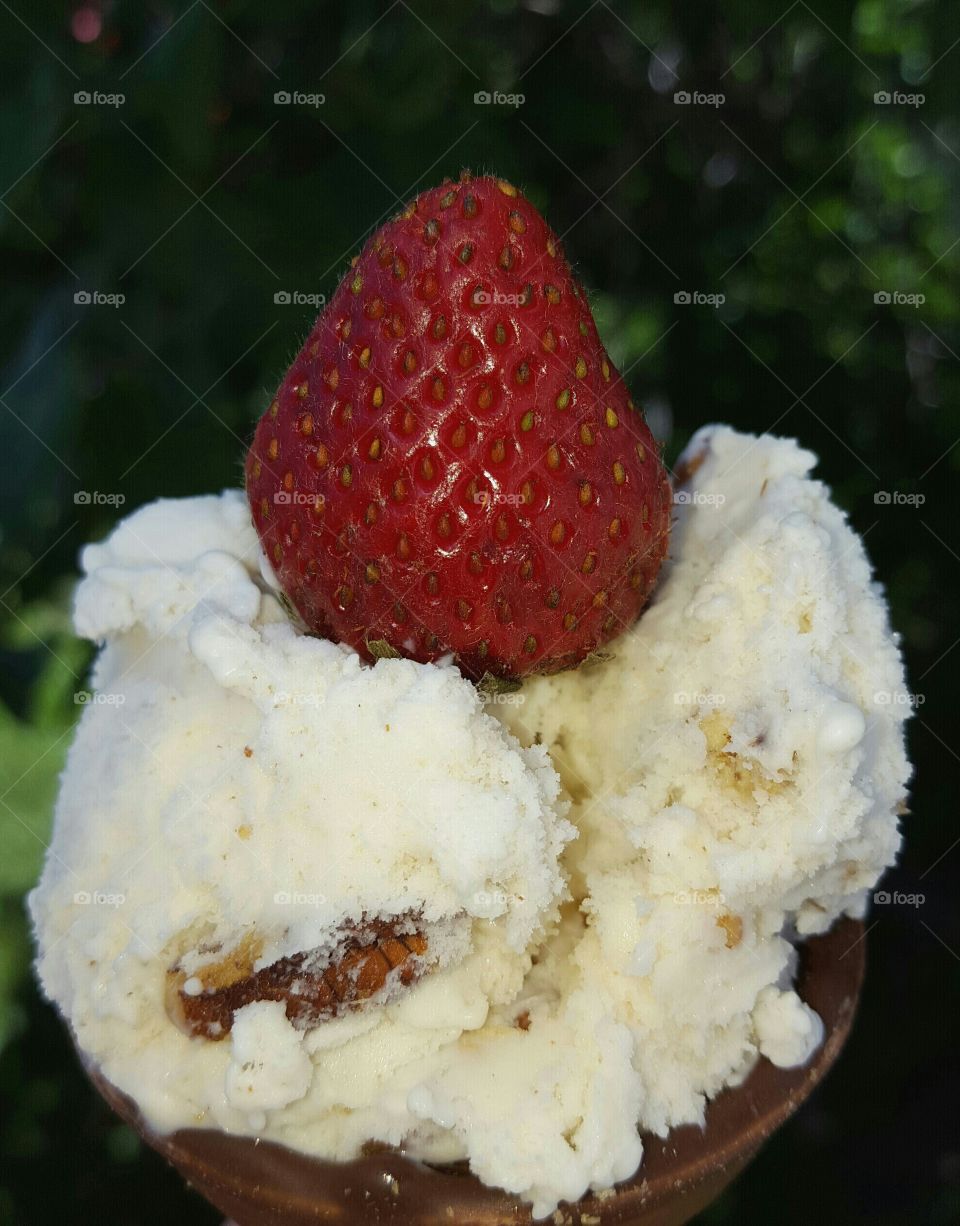 Butter Pecan Ice Cream Topped with Strawberry
