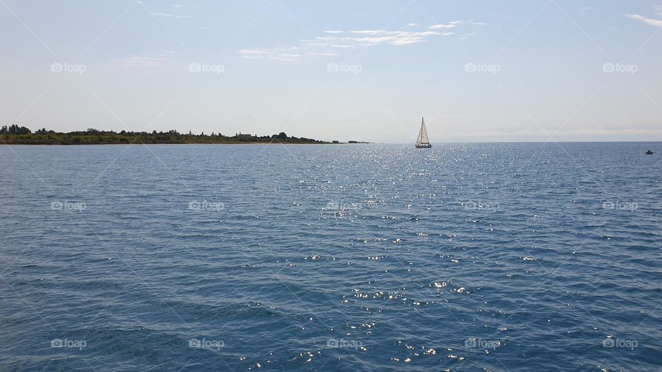 The lonely sail turns white