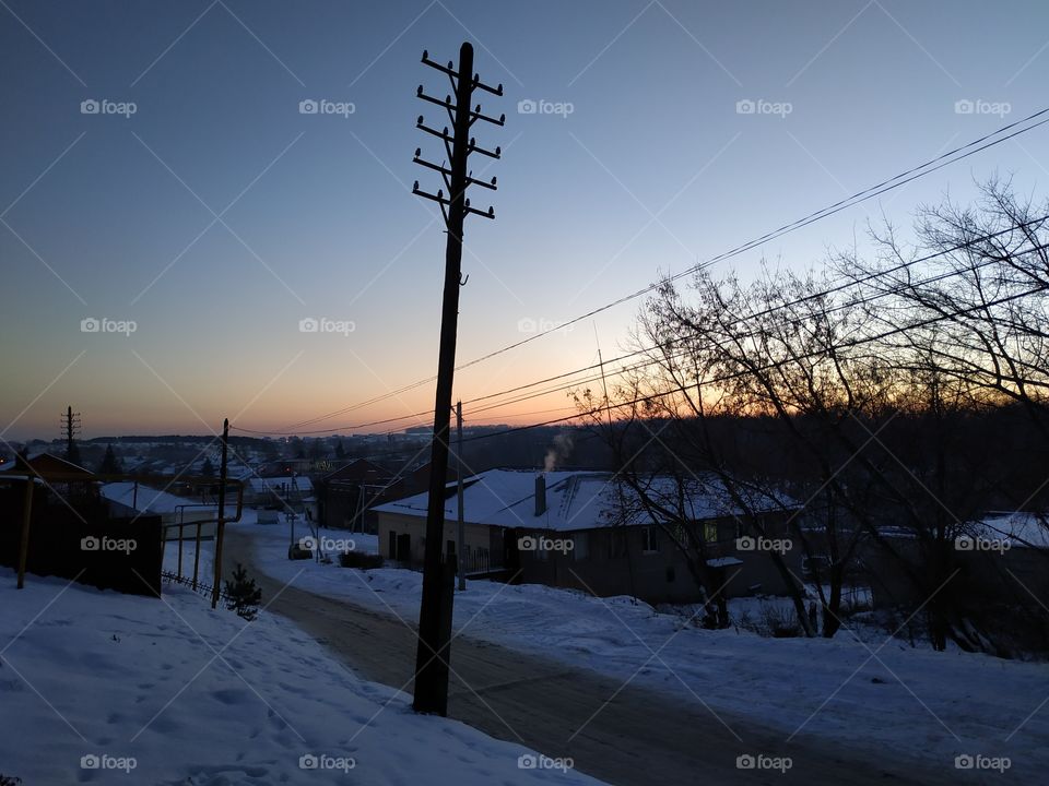 Winter sunset in Russian village