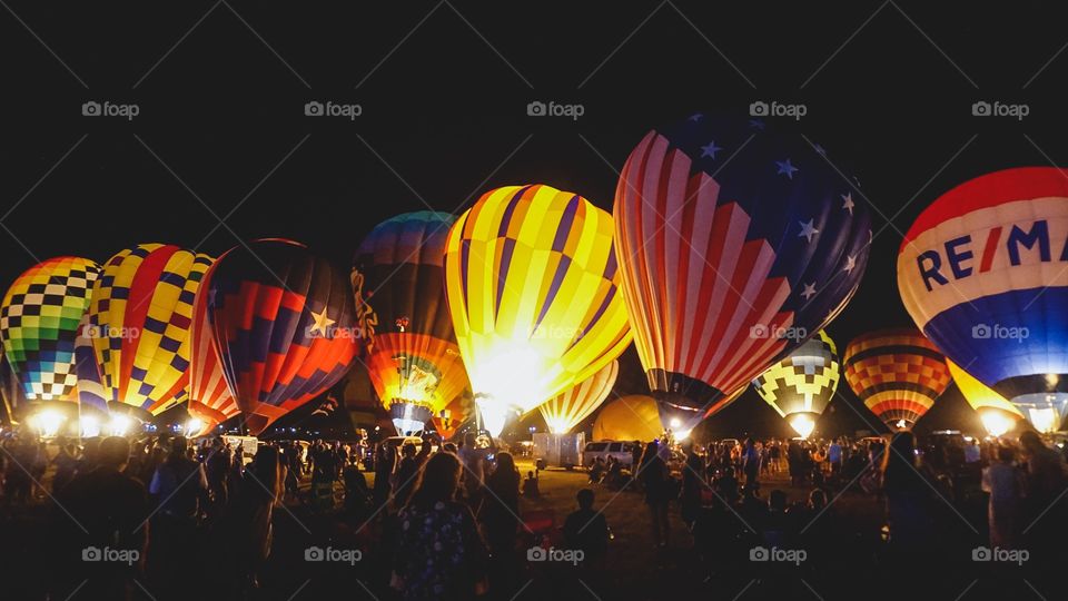 The Balloon Glow at the annual Great Texas Balloon Race, a field of hot air balloons lit up at night
