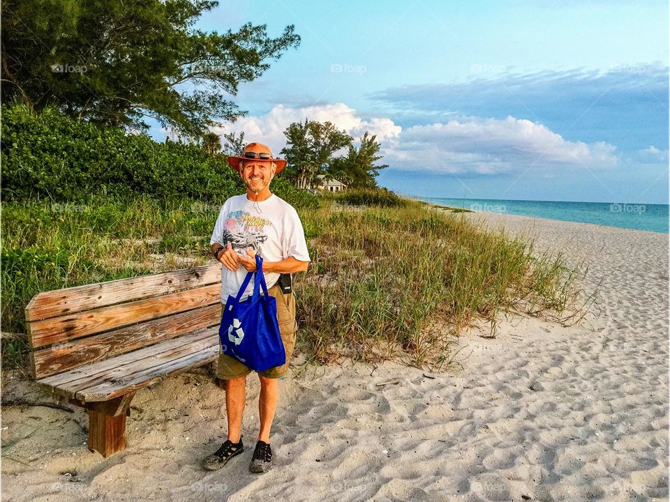 Handsome father figure on the beach. 