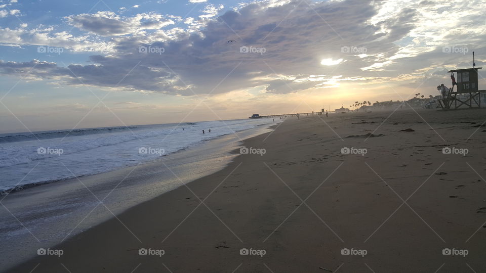 Life guard house on beach at sunset