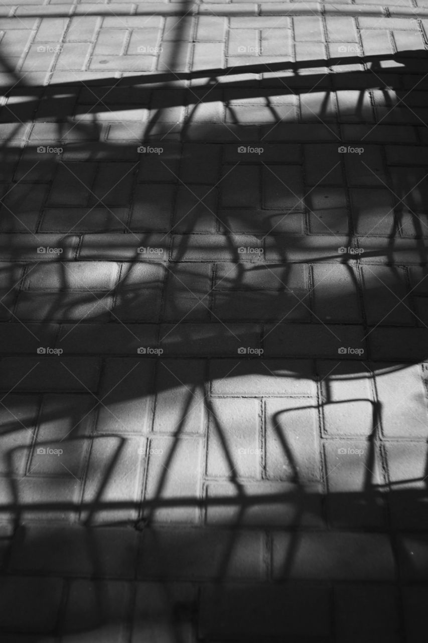 Beautifully arranged shadows of rails at the local park.