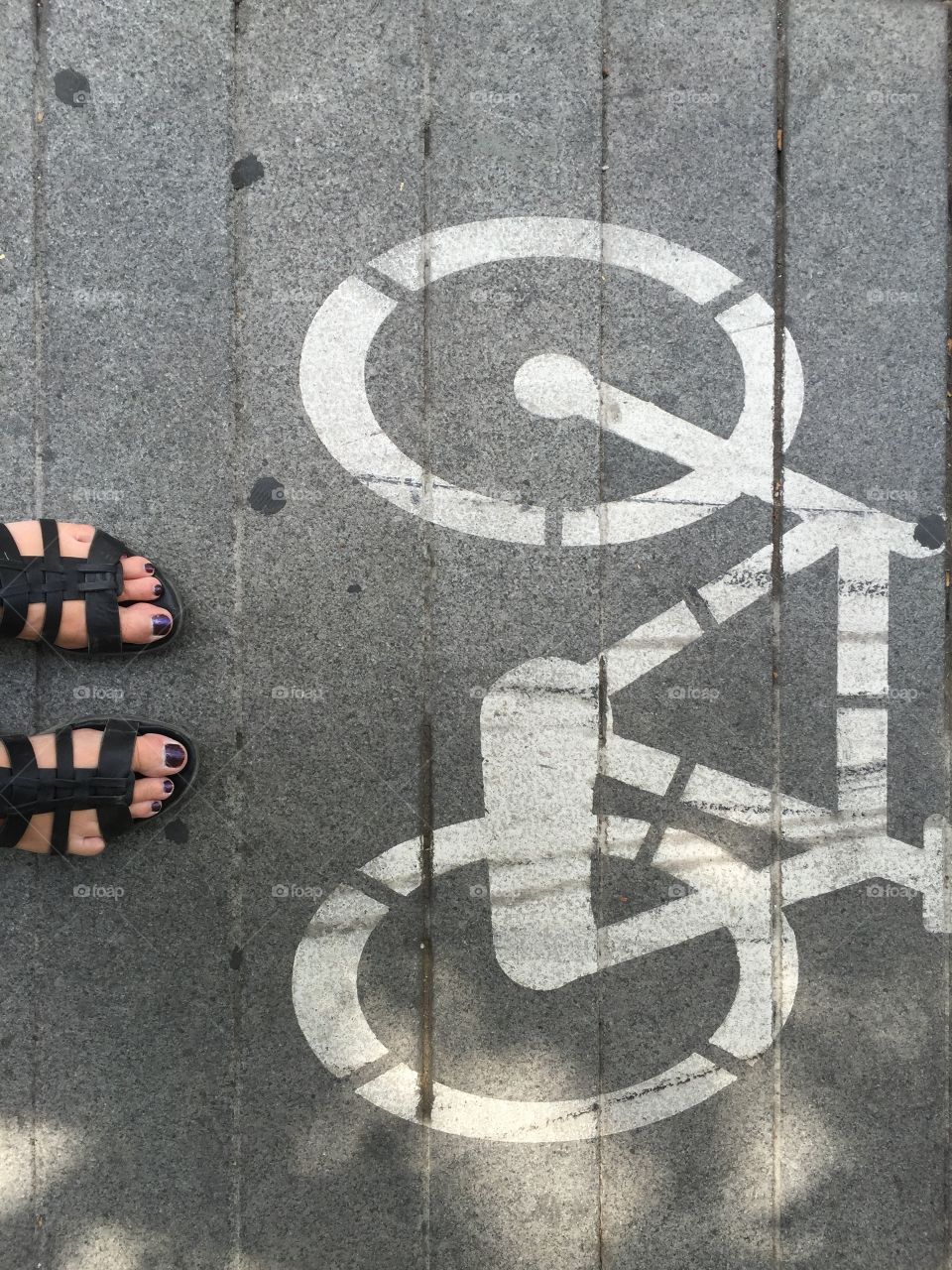 Feet on the biking lane 