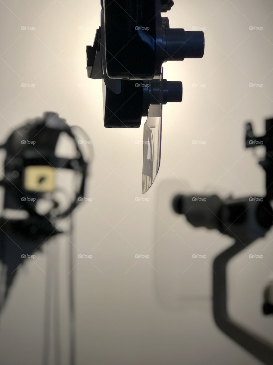Selective focus on ophthalmology equipment in medical setting