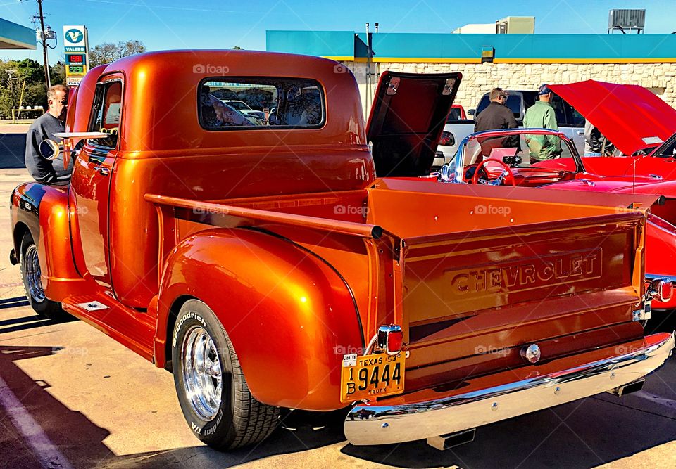 Restored vintage bright orange truck 