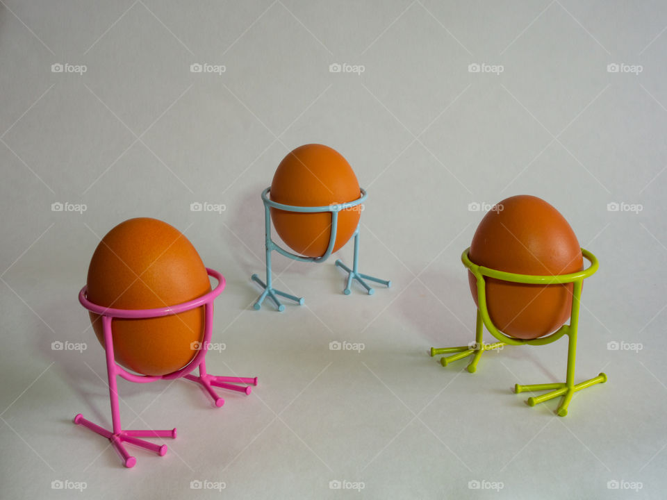 Eggs of brown color not decorated prepare for the holiday Paskh on a light white background.
