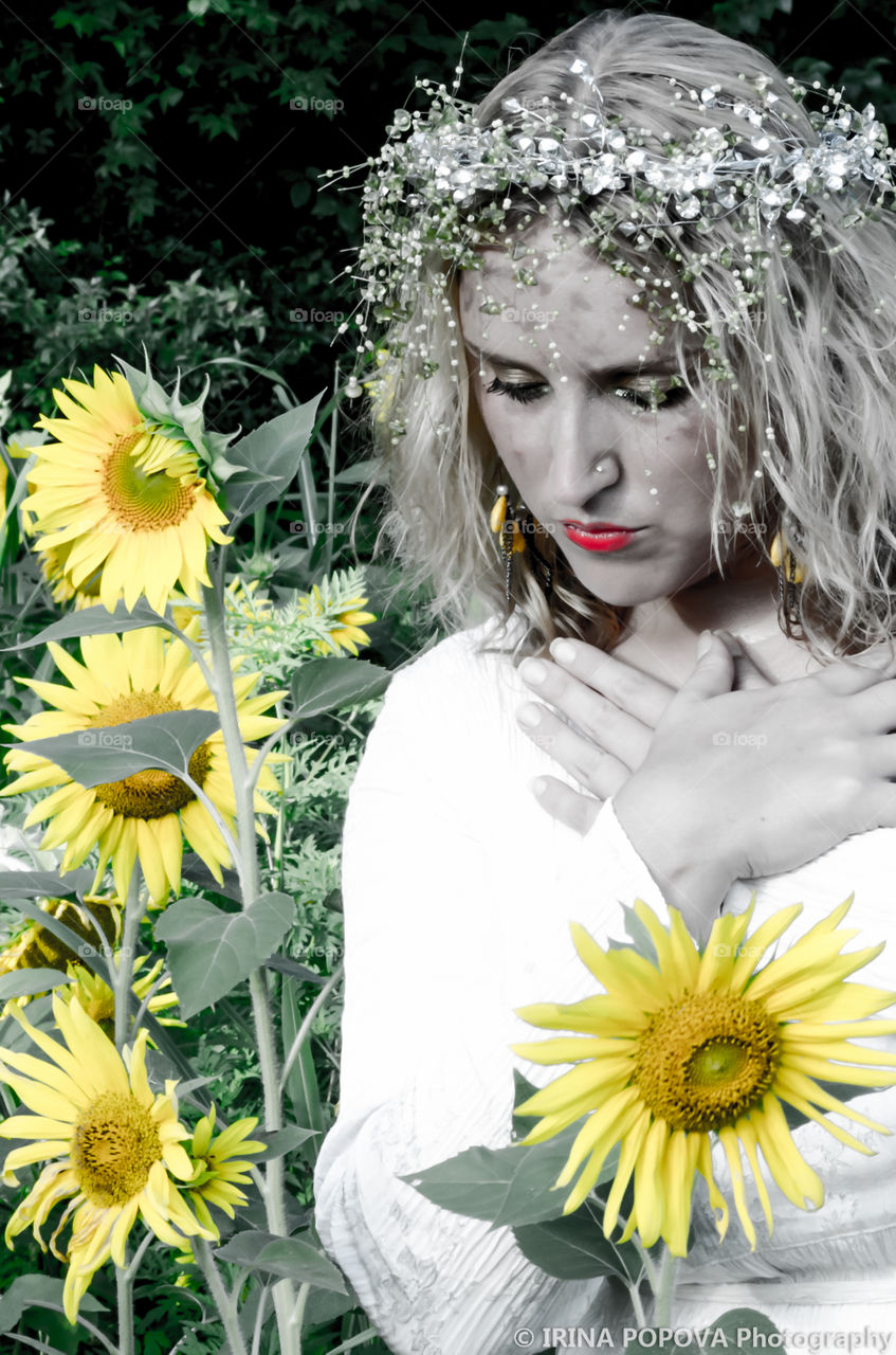 Woman in sunflower field