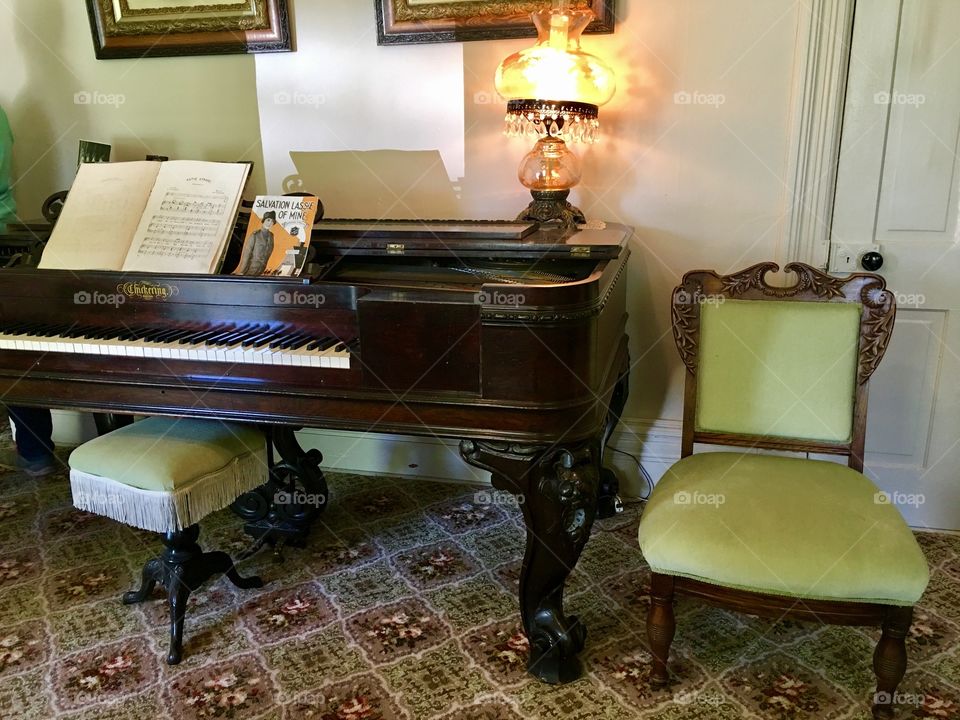  Historical home. Piano. Antique. Lamp. Chair. Green velvet . Beautiful. Old. Would. Homemade. Handcrafted.