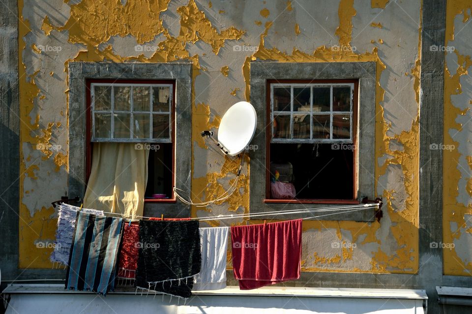 balcony with ruined colored plaster