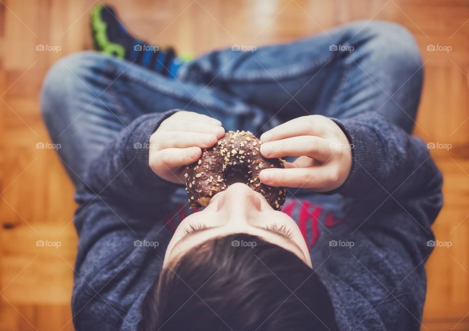 Kid eating a doughnut