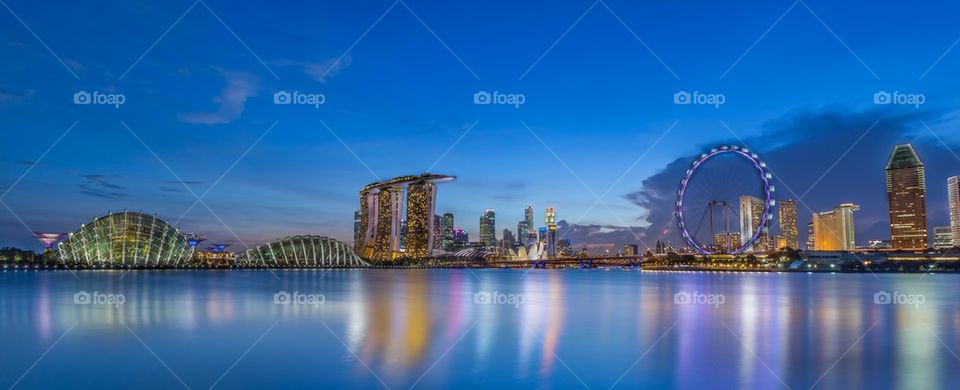 Illuminated city at waterfront, Singapore