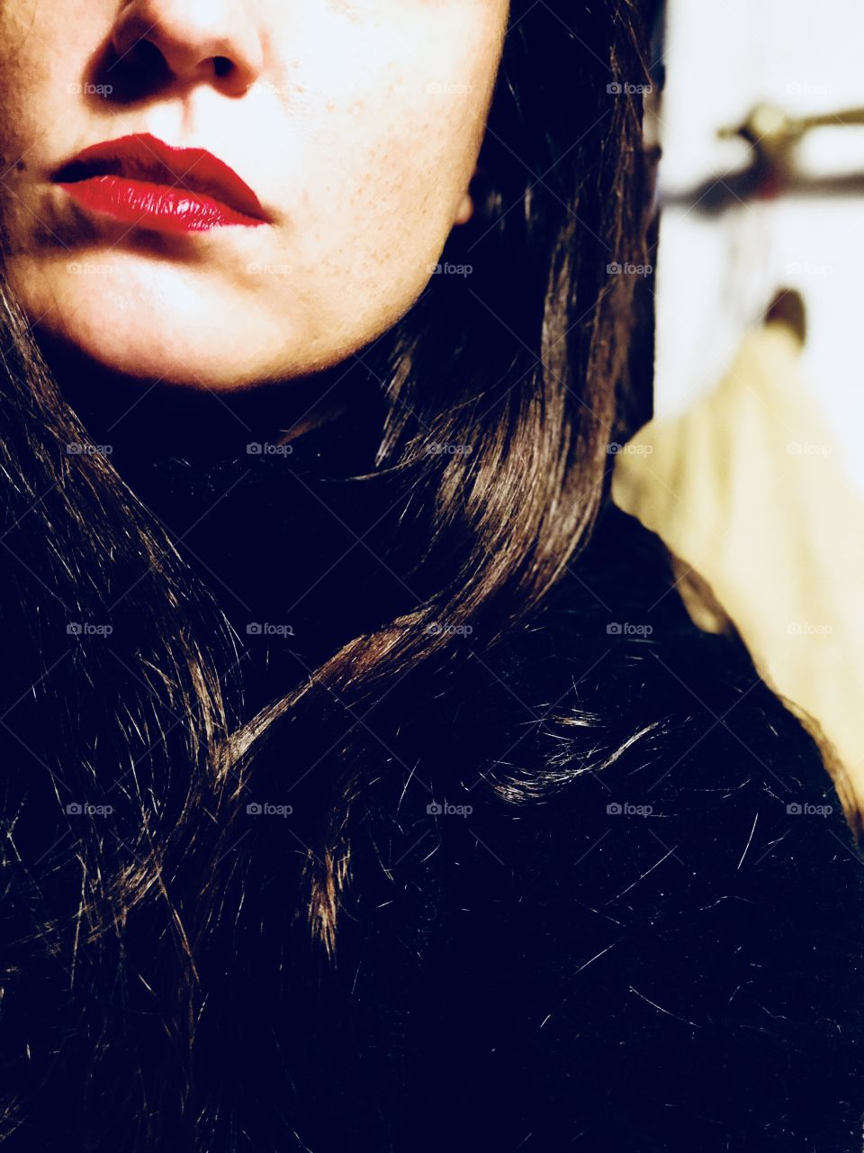 Woman mouth with a red lipstick