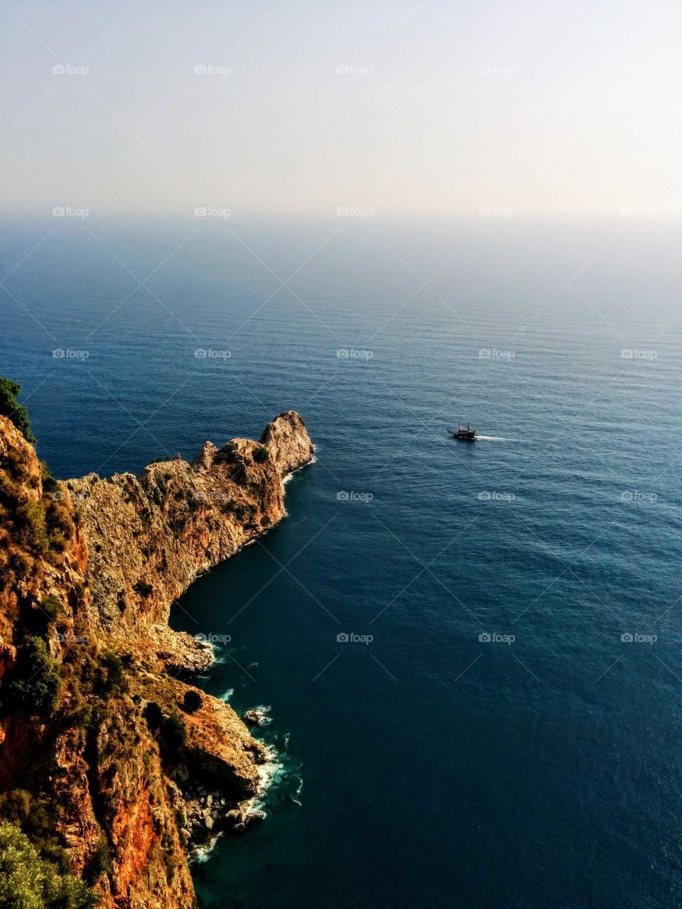 South of Turkey, overlooking the mediterranean sea. A "pirateship" is sailing across. The photo was taken on a summerholiday 2014.