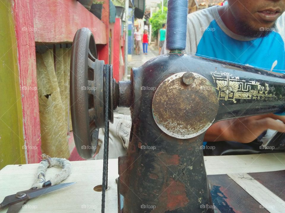 tailor with sewing machine