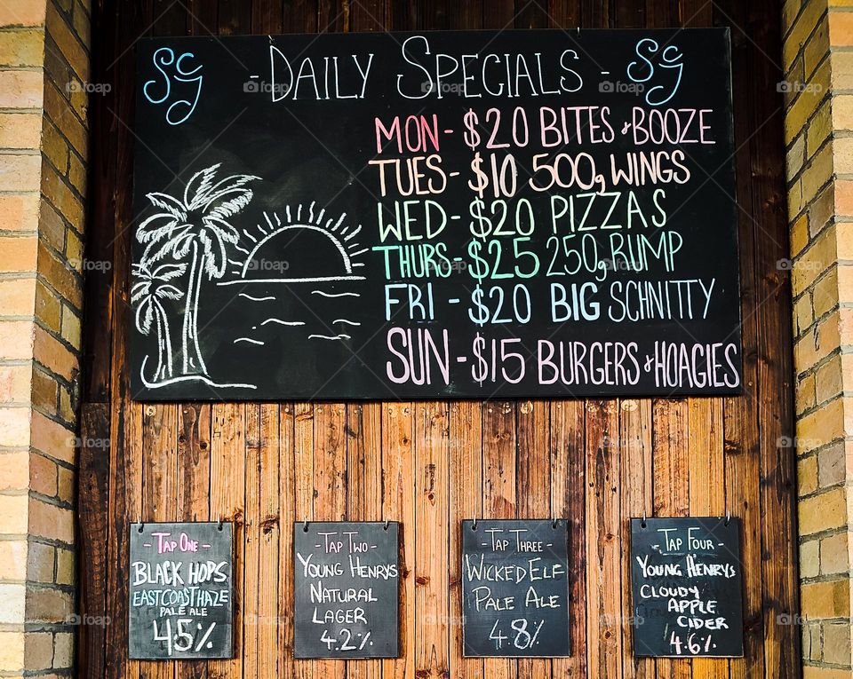 Colorful beer and food wall menu at my local pub