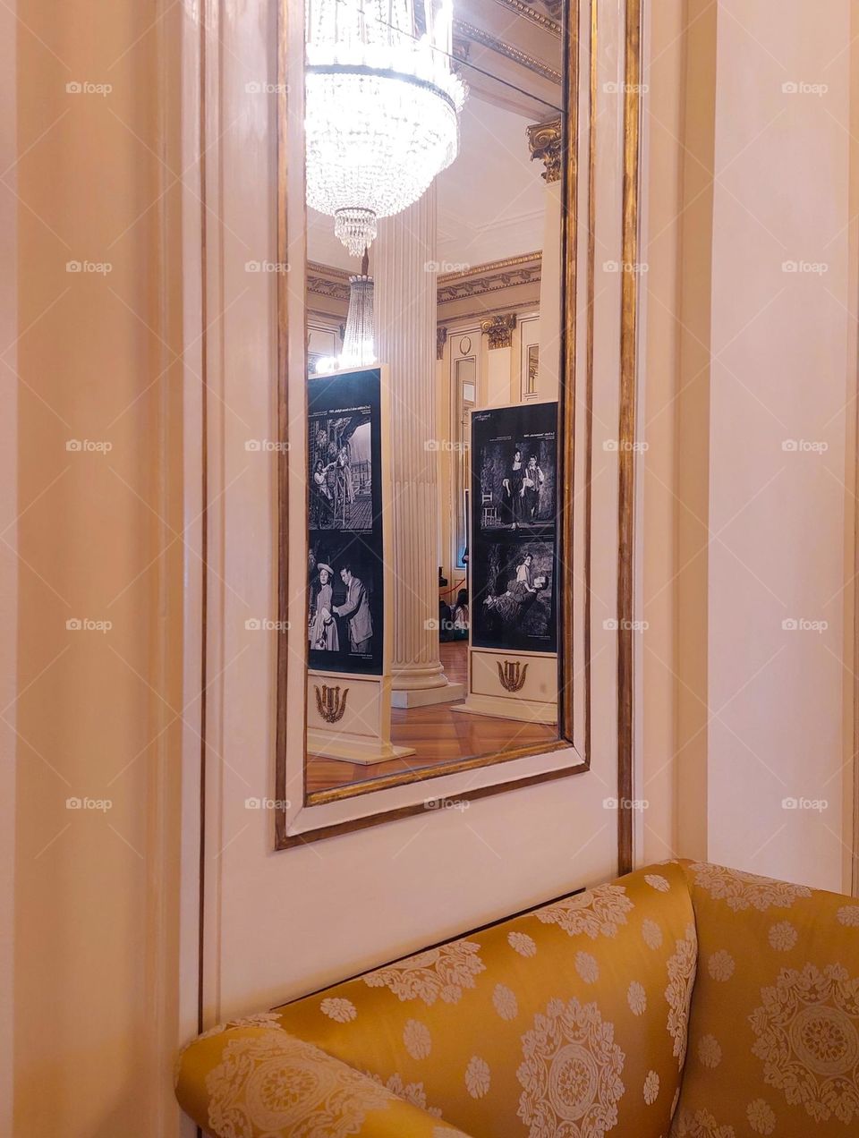 A view of the mirror in the Milan opera museum reflecting posters from the past