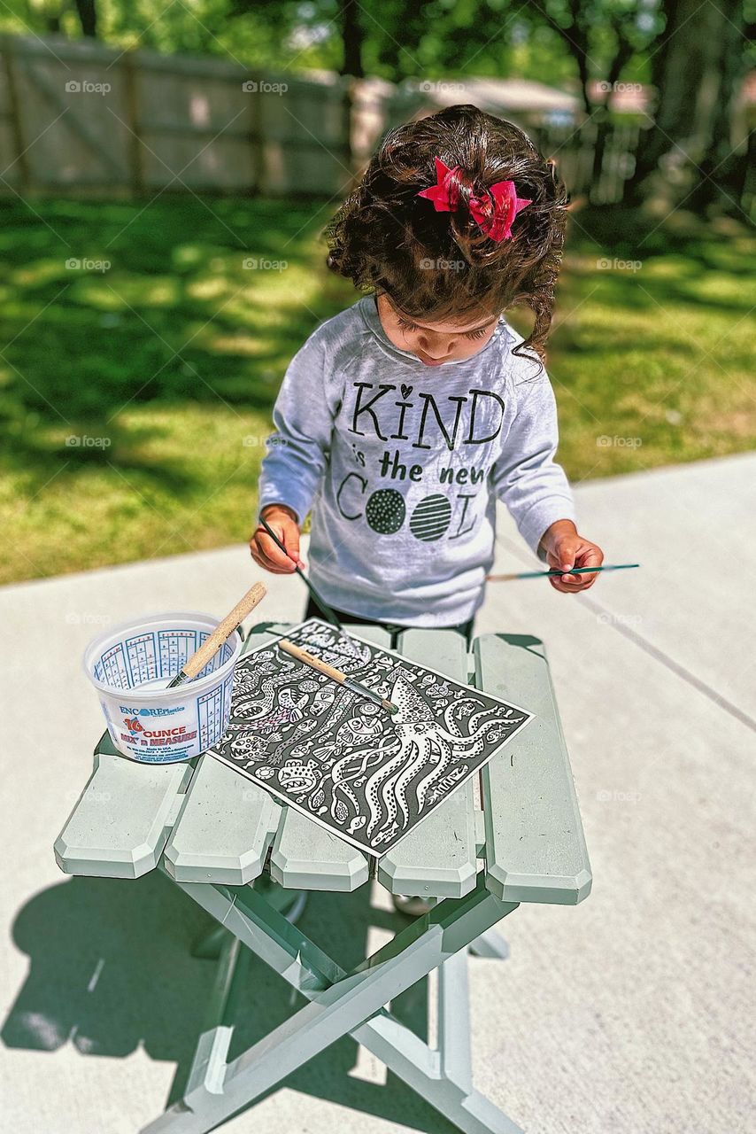 Toddler with paint brushes, painting outside with a toddler girl, colorful painting by a toddler girl, sea creatures art