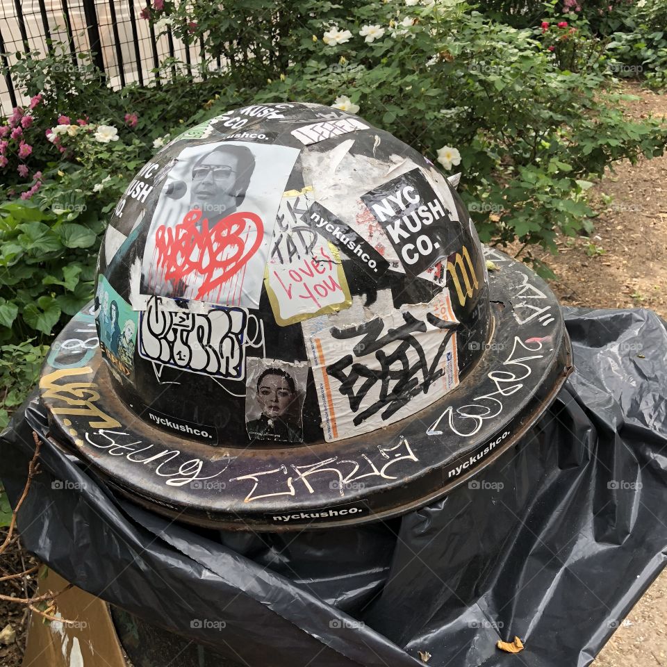 Trash can lid with stickers & graffiti, Nyc 