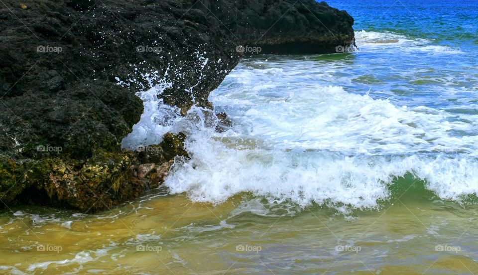 Wave splashing on rock