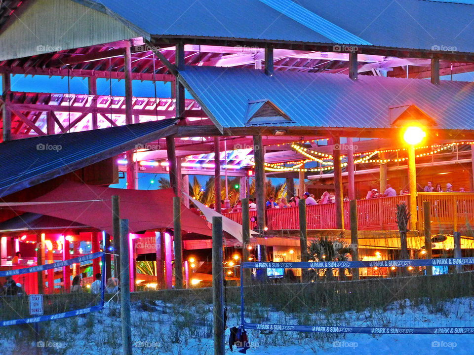 Families eating out on the beach in a vibrant and colorful environment!