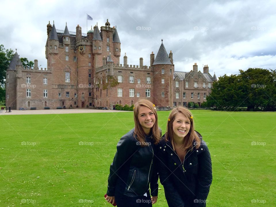 Sisters on a family vacation to Scotland. Outside of Glamis Castle. 