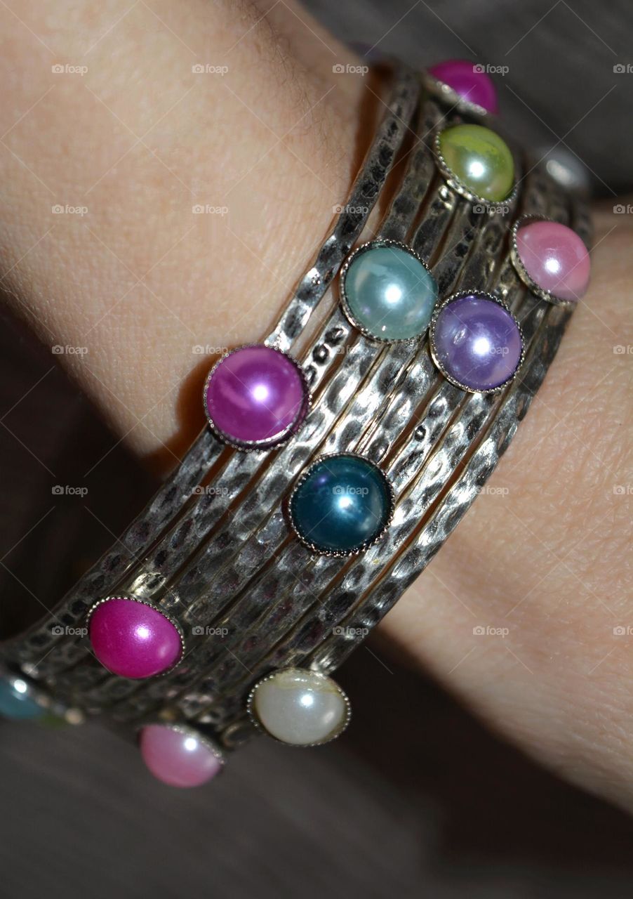 metal bracelet on a female hand close up colour