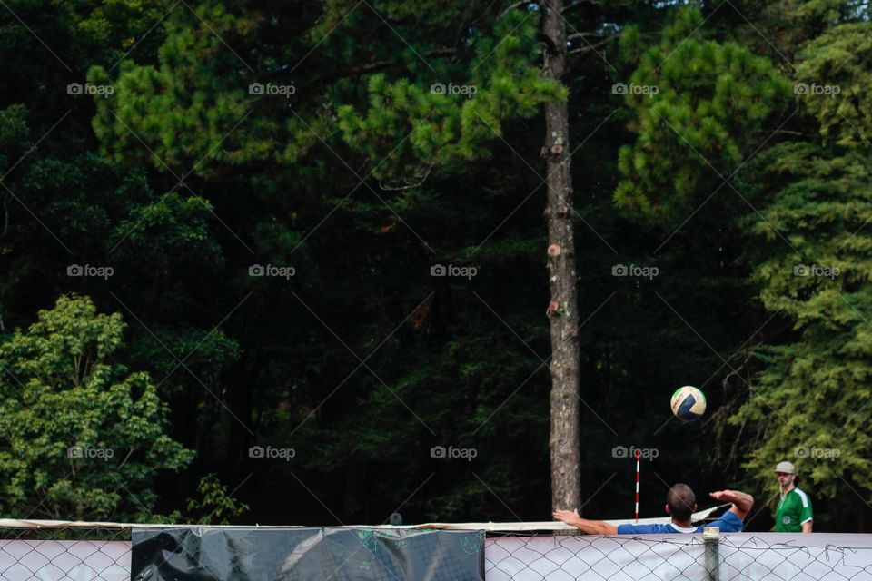 Boys playing volleyball 