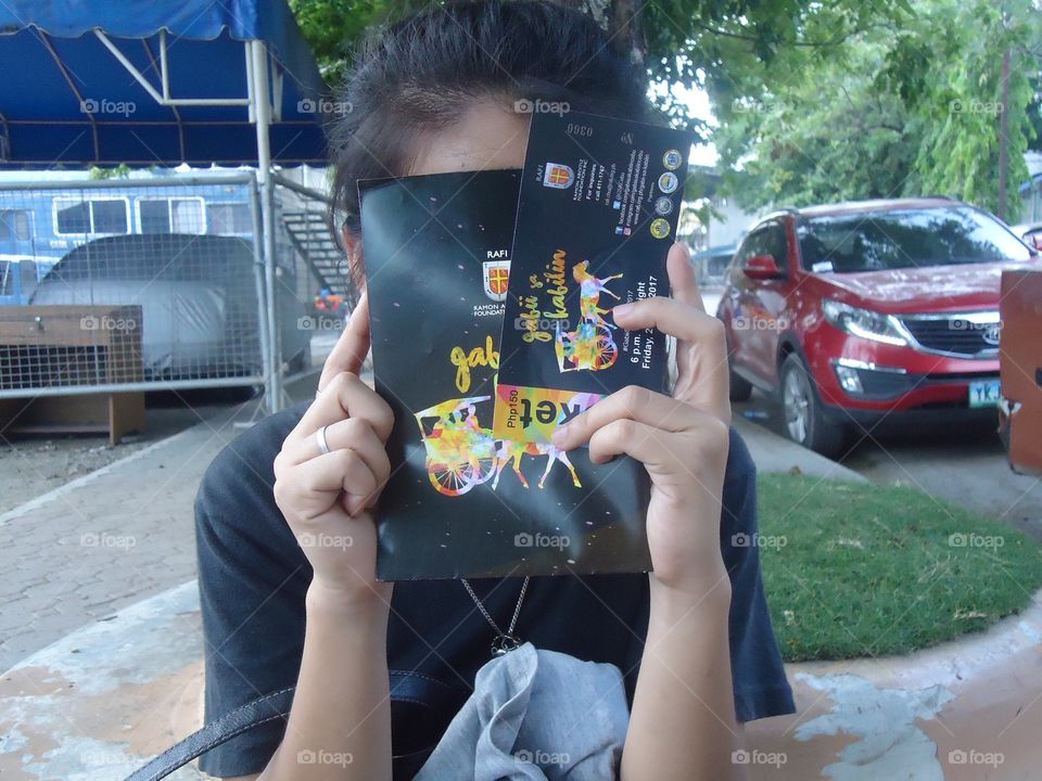 Here's a picture of my friend covering her face with the Night of Heritage ticket.