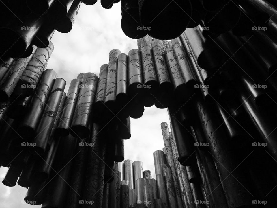 Standing under a monument 