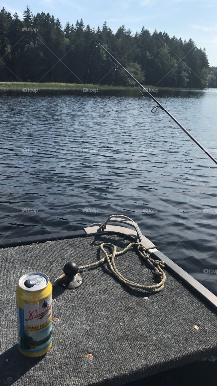 Drinking beer and catching fish