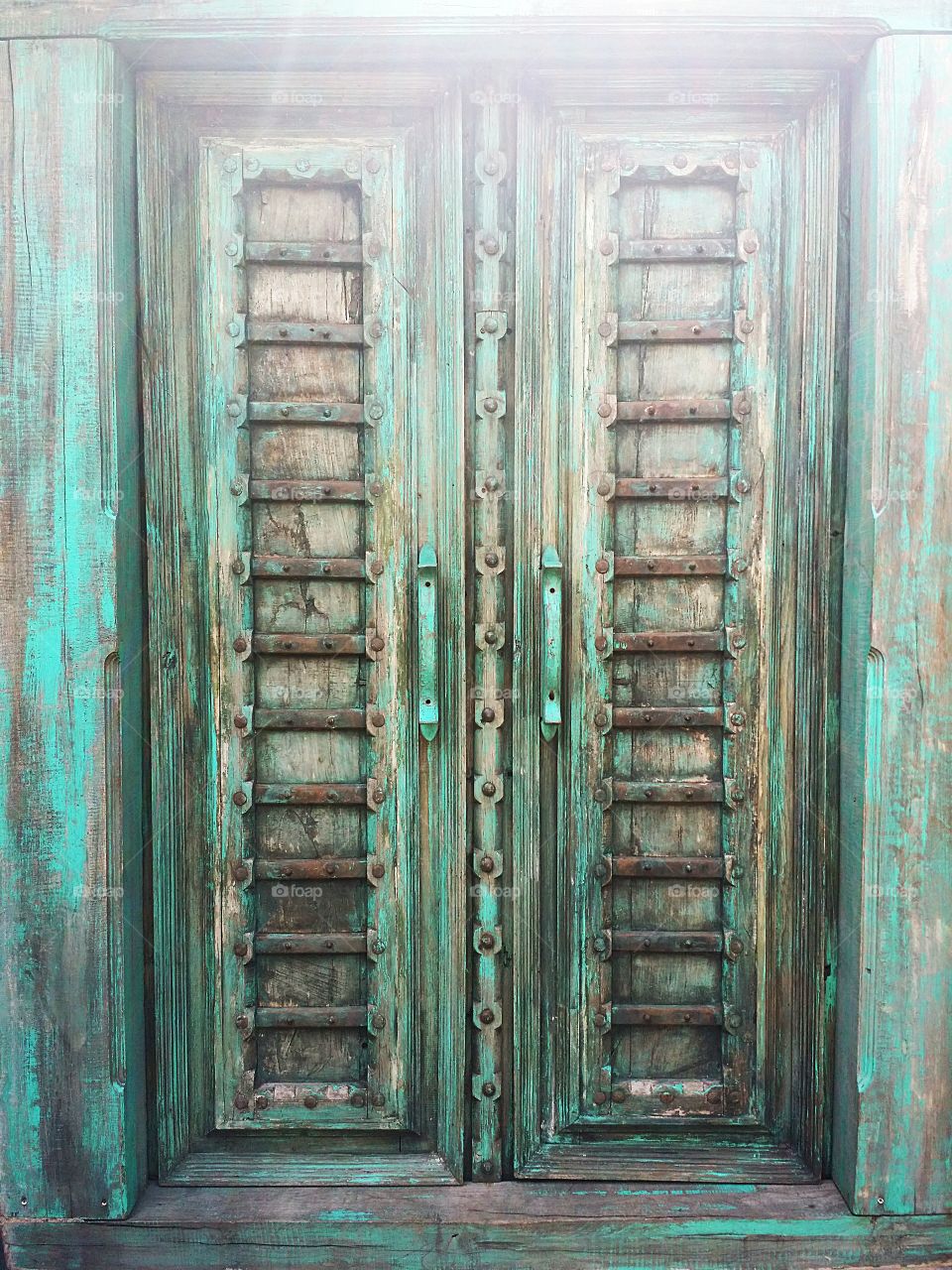 Old wooden door with sunlight.