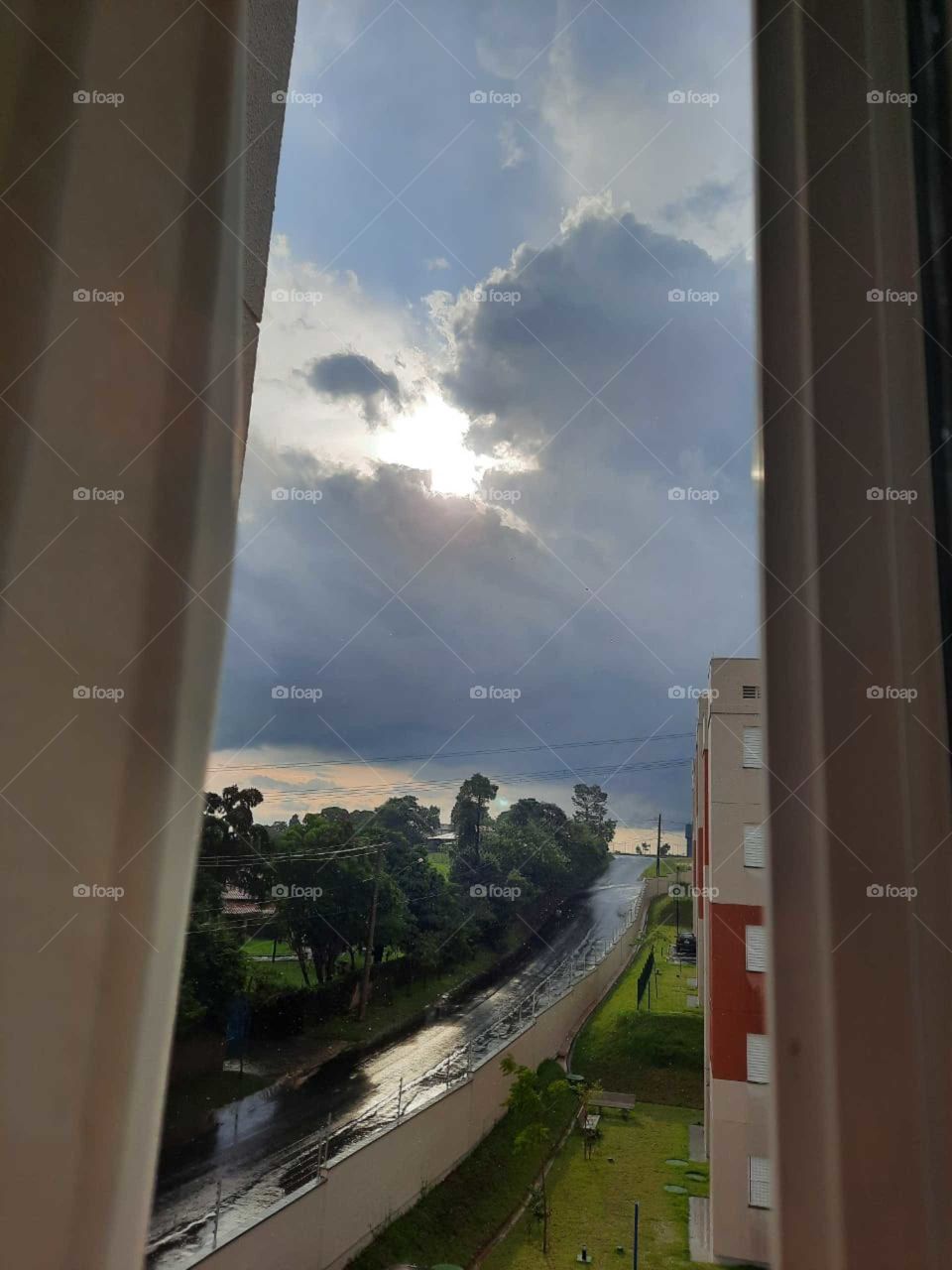 From the window of my apartment I was impressed with the closed weather that was outside, dark clouds with the sun setting at the end of the day.