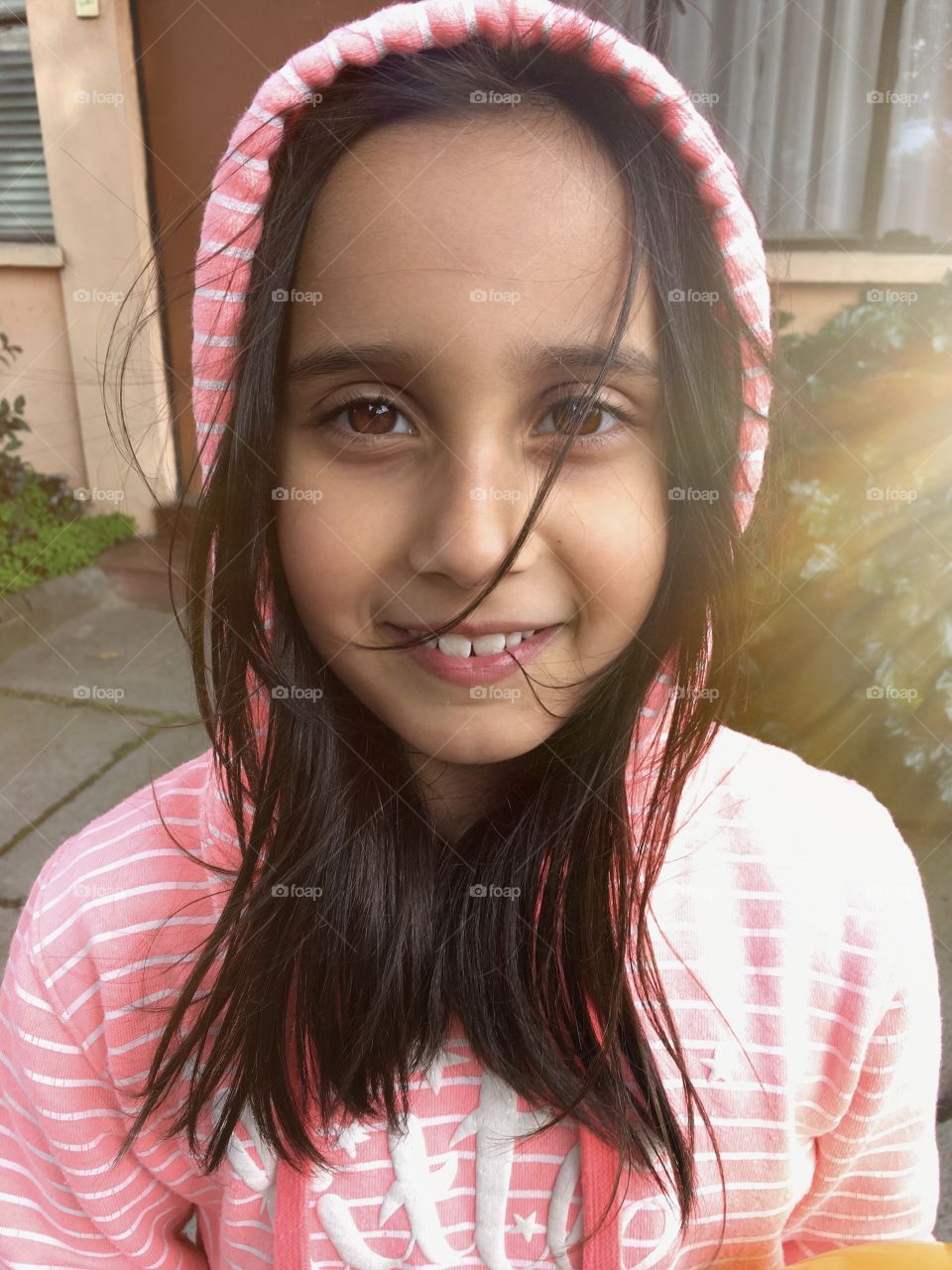 portrait of a little girl illuminated by the sun