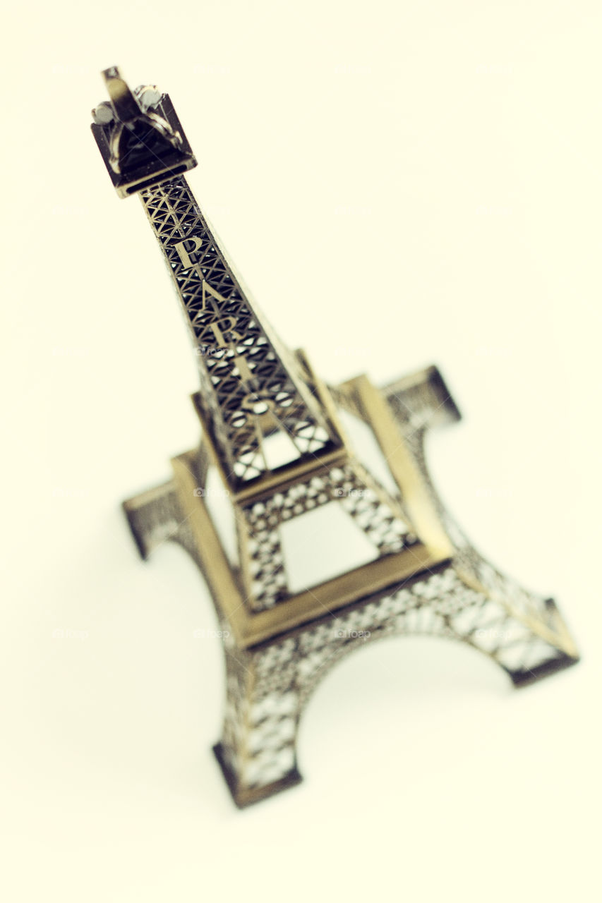 Eiffel Tower model over white background